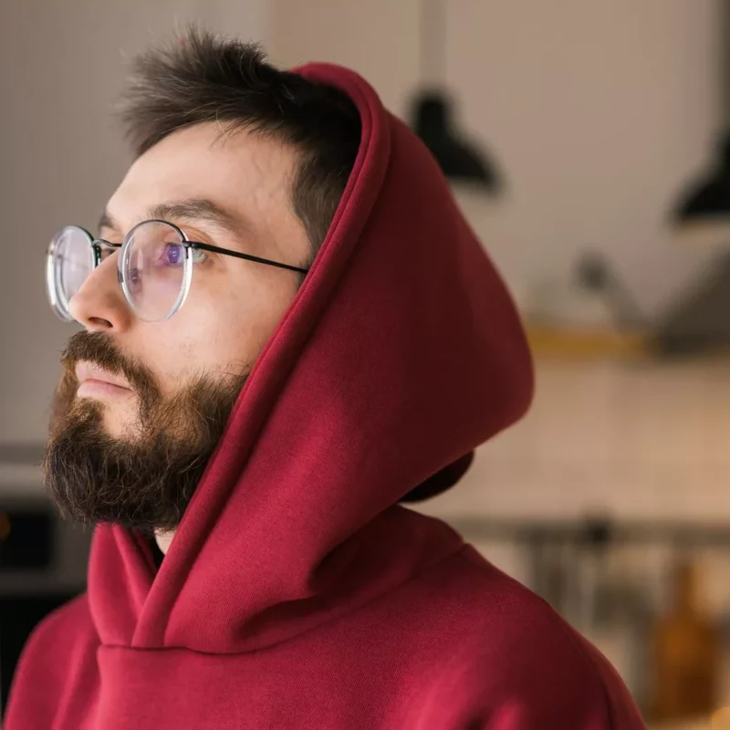 Sad man in a red hoodie