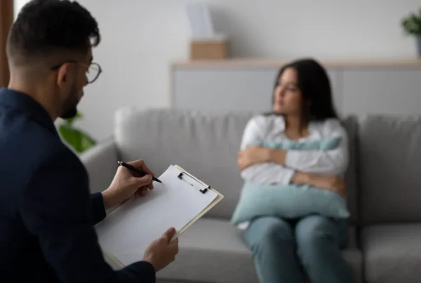 Young Arab Woman Discusses Her Feelings With a Psychologist in a Therapy Session