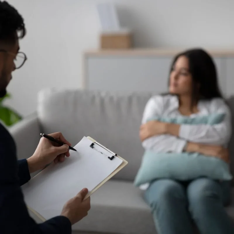 Young Arab Woman Discusses Her Feelings With a Psychologist in a Therapy Session