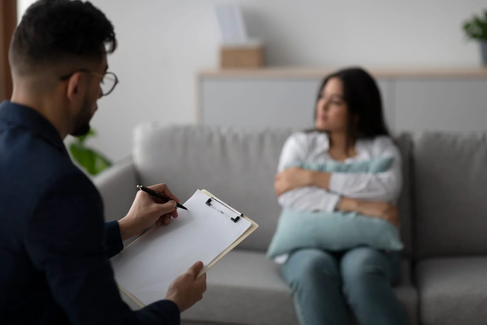 Young Arab Woman Discusses Her Feelings With a Psychologist in a Therapy Session