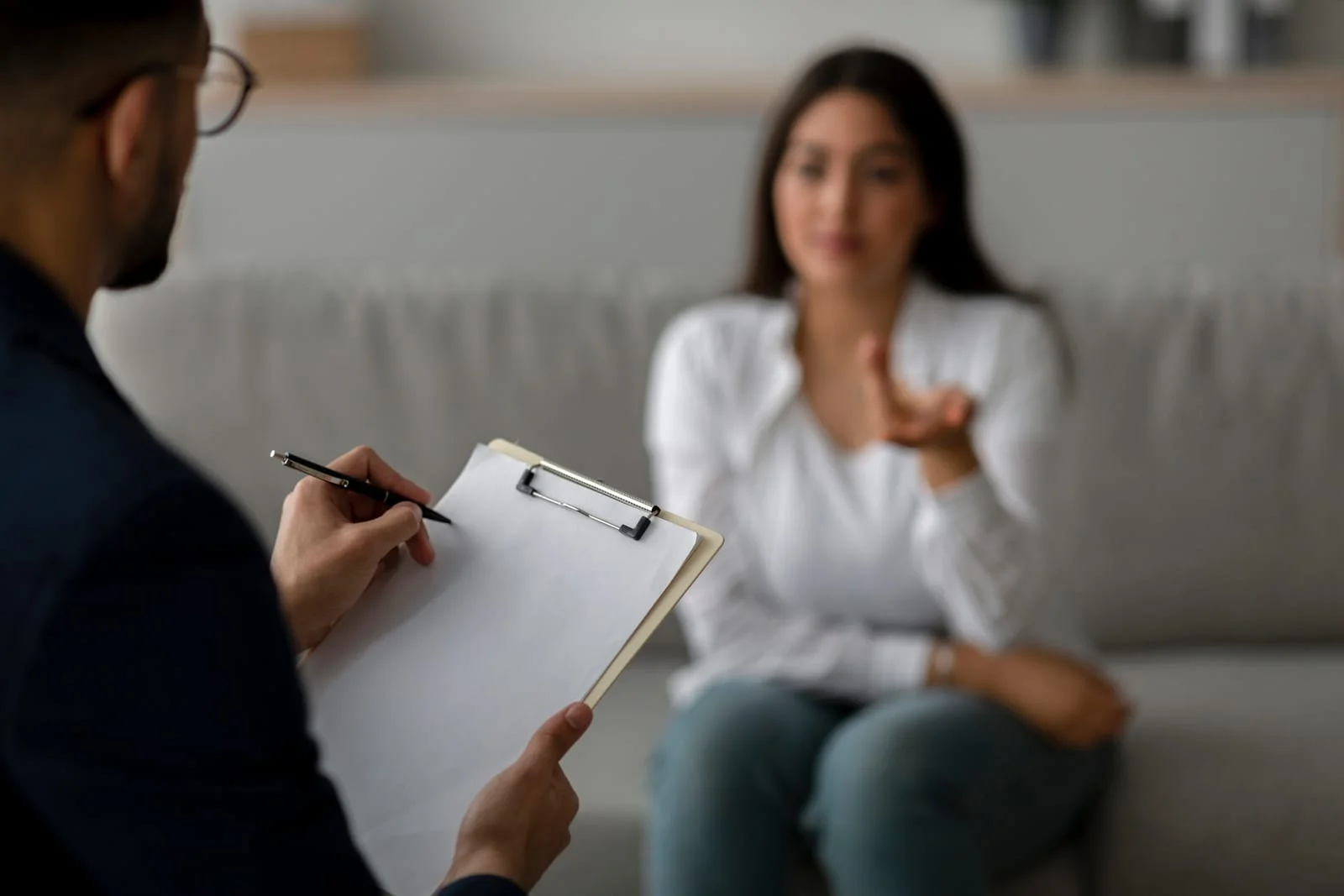 Stressed Arab Woman Seeking Help During a Therapy Session in a Medical Office